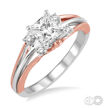 Load image into Gallery viewer, she will surely say 'yes' at the look of this charming diamond semi-mount ring. Styled in 14 Karat White and Pink gold, this ring is embellished with 4 prong set round diamonds on the three row split shank, which accentuates the rings elegance. The Center stone awaits for your choice of a center stone ranging from .40 carat to .60 carat and is sold separately and is not included in the price. Finger size is 6.5. The total diamond weight of the ring is 1/10th carat.
