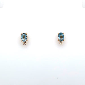 These Stud Earrings Feature an Oval Aquamarine Gemstone with a small diamond at the Bottom of the Setting.  The Earrings are Secured with Posts and Push on Backs.