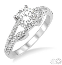 Load image into Gallery viewer, Express your eternal love to your love with this resplendent diamond Engagement Ring. Styled in Glinting 14 Karat White Gold, this ring is embellished with 48 sparkling round diamonds, prong set, accenting diamonds that flow down the split shank in brilliant rows. The ring showcases a .47 Carat round SI-1 I Diamond.  The Total Diamond Weight of the ring is .80 Carat
