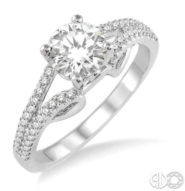 Express your eternal love to your love with this resplendent diamond Engagement Ring. Styled in Glinting 14 Karat White Gold, this ring is embellished with 48 sparkling round diamonds, prong set, accenting diamonds that flow down the split shank in brilliant rows. The ring showcases a .47 Carat round SI-1 I Diamond.  The Total Diamond Weight of the ring is .80 Carat