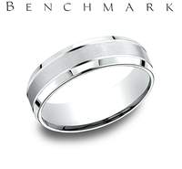 This 14 Karat White Gold Men's Light Comfort Fit 6.5mm Band Features a Satin Center Finish with 2 Cuts and High Polish on the Outside.  Finger Size 9  Total Weight 6.5 Grams