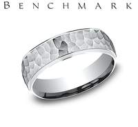 This 14 Karat White Gold 6.5mm Light Comfort Fit Band Features a Hammered Design with High Polish on the Outer Edge.  Finger Size 11  Total Weight 6.4 Grams