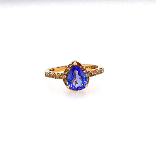 This 14 Karat Yellow Gold Estate Ring Features a 1.12 Carat Pear Shape Tanzanite Gemstone with 28 Diamonds to Form a Halo Design.  Total Weight 2.5 Grams  Finger Size 5  Estate Ring - All Weights are Approximate