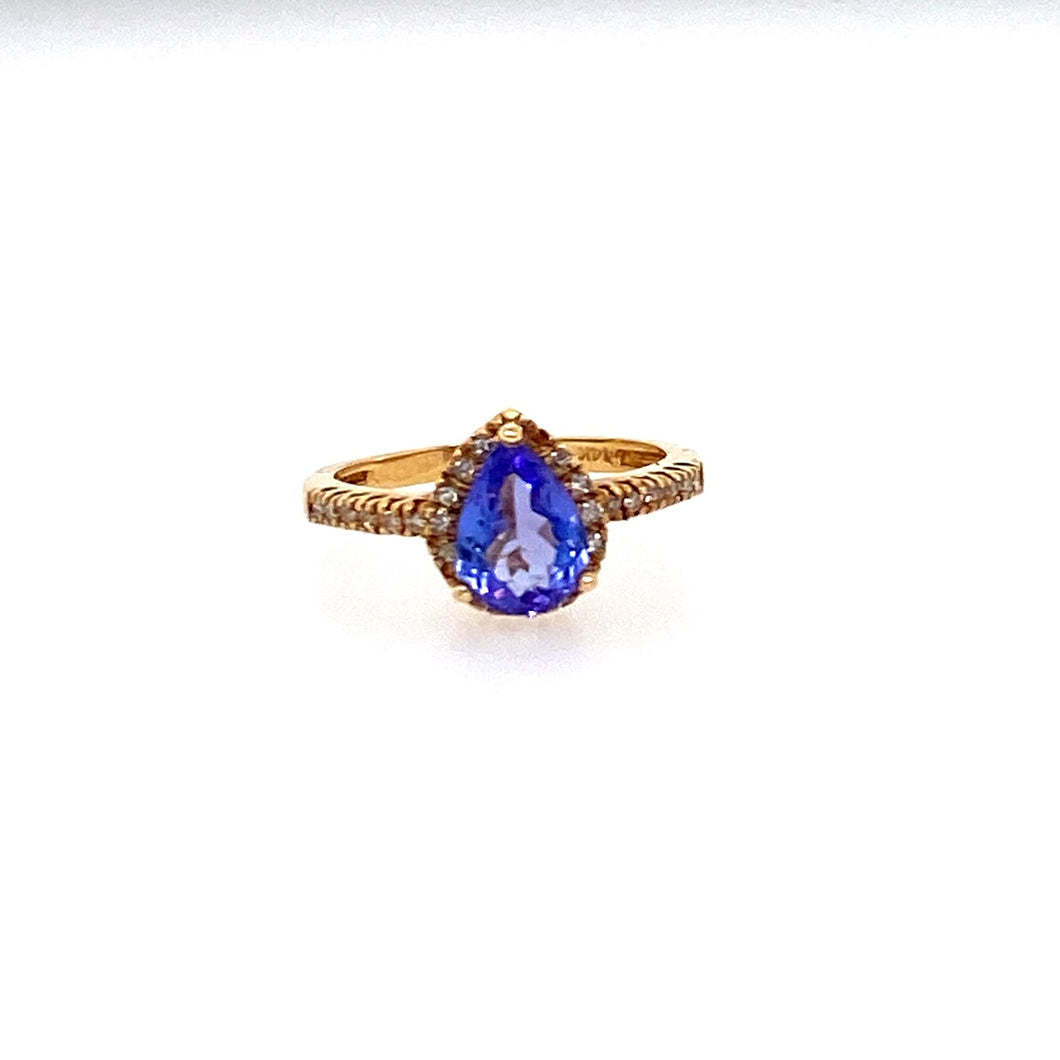 This 14 Karat Yellow Gold Estate Ring Features a 1.12 Carat Pear Shape Tanzanite Gemstone with 28 Diamonds to Form a Halo Design.  Total Weight 2.5 Grams  Finger Size 5  Estate Ring - All Weights are Approximate