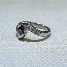 Load image into Gallery viewer, Beautifully set in Platinum, this estate ring features a .64 Carat Ruby gemstone with .15dtw of diamonds to accent the stone. Total Weight of the ring is 7.6 Grams.  Finger size is 6
