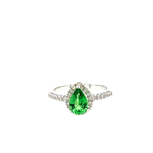 Discovered in Kenya and Tanzania, this pretty Pear Shaped Tsavorite Gemstone Ring is set in a Diamond Halo Design in 10 Karat White Gold.  Finger Size 5 