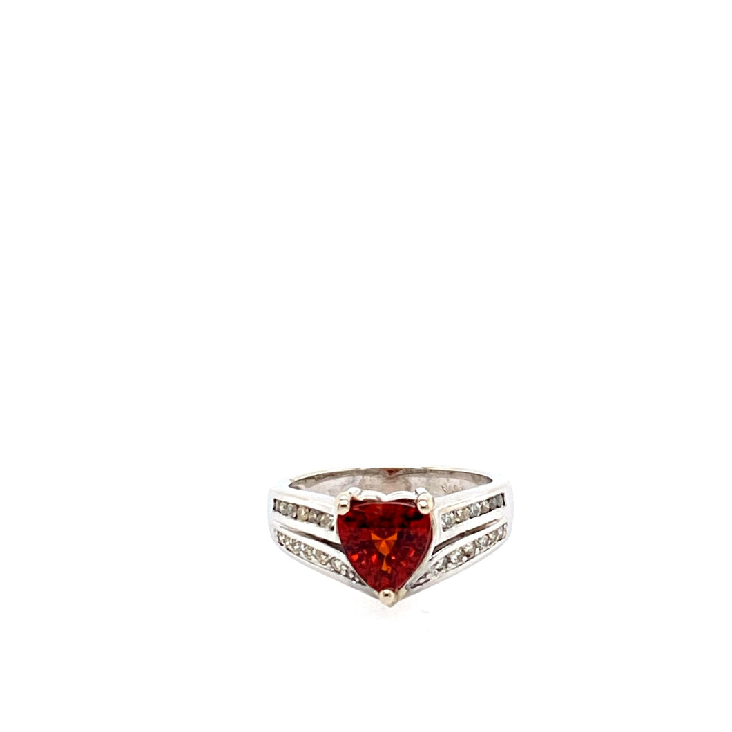 You will love the vibrant color of this Spessartite Trillion Cut Gemstone.  The 14 Karat White Gold Ring setting features Two rows of Channel set Diamonds.  Total Weight is 5.5 Grams  Finger Size is 6.75