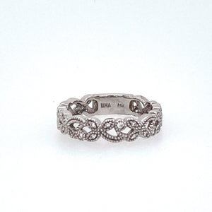 This 14 Karat White Gold Eternity Band with a Sizing Bar Features a "Petal" like Design with .20dtw of Diamonds.  Total Weight is 3.7 Grams  Finger Size is 6.25