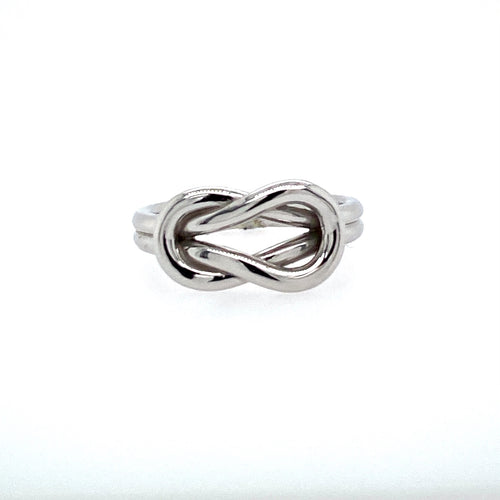 This Beautiful 14 Karat White Gold High Polished Ring Features a Love Knot and a Double Shank. Finger Size 6  Total Weight 5.5 Grams