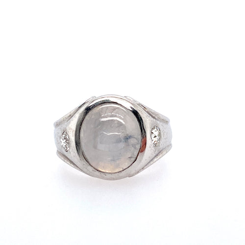 This Men's Estate Ring Features an Oval Gray Star Sapphire with a Burnish Set Diamond set on Both Sides of the Gemstone.   Finger Size 6.75  Total Weight 10.3 Grams Approximate Total Diamond Weight .32 Carat