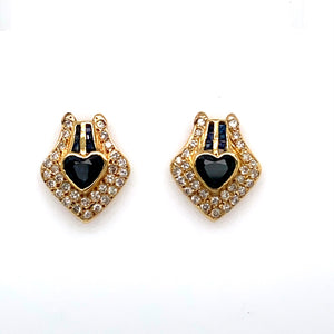These Beautiful Estate Earrings Feature 14 Karat Yellow Gold with a Heart Shaped Blue Sapphire Gemstone at the Center with Two Rows of Baguette Blue Sapphires above the Heart, along with 1.00 Full Carat of Sparkling White Diamonds set throughout the Pair.  The Earrings are Secured with Posts and Backs.  Estate Weights are Estimated 