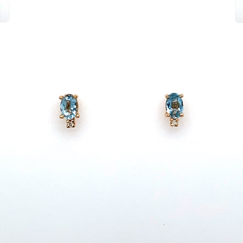 These Stud Earrings Feature an Oval Aquamarine Gemstone with a small diamond at the Bottom of the Setting.  The Earrings are Secured with Posts and Push on Backs.