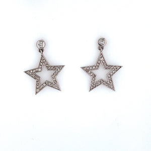 This Pair of 14 Karat White Gold Earrings Feature a Bezel Set Round Diamond at the Top with a Open Diamond Star Dangling from the Bottom. The Earrings are Secured with Posts and Screw Backs.  Total Diamond Weight .47 Carat