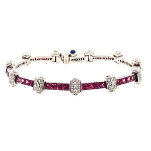 Pretty in Pink with this Estate Bracelet. This 18 Karat White Gold Charriol Flamme Blanche Bracelet Channels in 5.2ctw of Pink Sapphires and 2.97ctw of VS Diamonds. The Custom made Clasp includes a hidden safety.   Length is 7"  Total Weight is 25.6 Grams