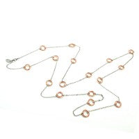 This 31" Long Love Knot Necklace Features Sterling Silver Chain with Rose Gold Plated Love Knot Links Throughout the Necklace. Designed by Frederic Duclos.