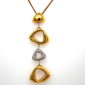 This Gorgeous 18 Karat Yellow Gold and White Gold Geometrical Necklace Designed by Cherie Dori Features a Two and a Quarter Inch Long Drop with High Polished 18 Karat Yellow Gold Triangular Shaped Settings and a Triangular Shaped Pave Diamond Setting. The Drop is Hung by a Three Strand 18 Karat Yellow Gold 17" Chain, Secured with a Lobster Clasp.