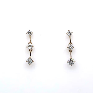 These 14 Karat White Gold Estate 3 Diamond Drop Earrings are Secured with Posts and Push on Backs.  Approximate Total Diamond Weight 1.00 Carat