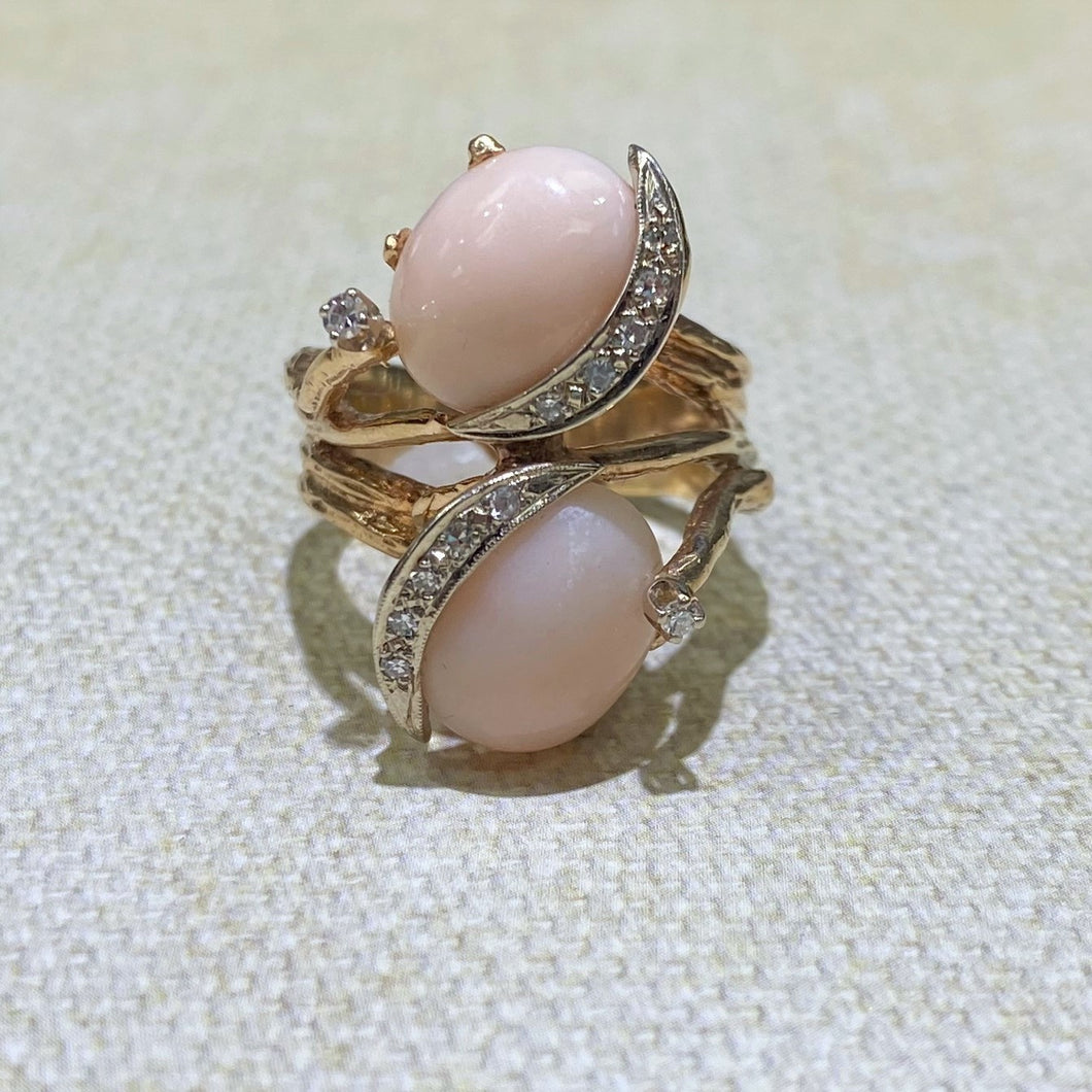 Estate 14 Karat Yellow Gold Two Coral Cabochon-Cut ring with an added touch of accent diamonds to this freeform ring. Finger Size is 7.5. Total Weight is 12.3 Grams