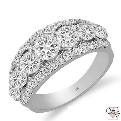 This gorgeous 14 Karat White Gold Wide Wedding Band has a total weight of .44 carat of diamonds down both outside edges of the ring. The Band is waiting for your choice of 7 graduated stones (not included in price, sold separately).  The 7 center stones are sold separate;y, not included in price  Finger size is 6