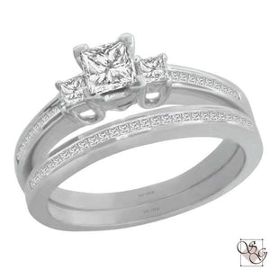 You will be set for her to say "yes" and "I do" with this beautiful 14 Karat White Gold 2 Piece Set. The Engagement ring  is set with 3 Diamonds, and is designed with accent diamonds along the sides of the 3 stones and in the matching band.  The Total Diamond weight of the set is .70 Carat.  Finger Size is 5.25