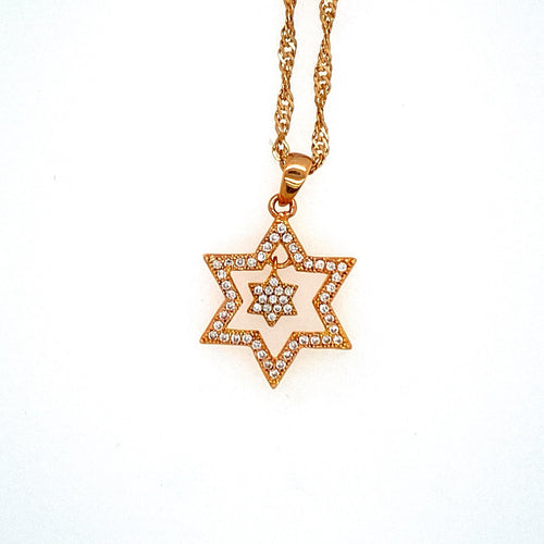 This Sterling Silver and Yellow Gold Plated Star of David Necklace Features a Open Star set with Cubic Zirconia's, and a Tiny Star of David Dangling on the Inside, set with Cubic Zirconia's. The Twisted Yellow Gold Plated Chain is Included.